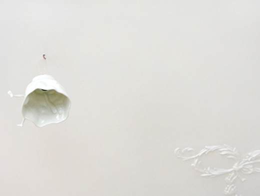Porcelain lamp with embossed ornament